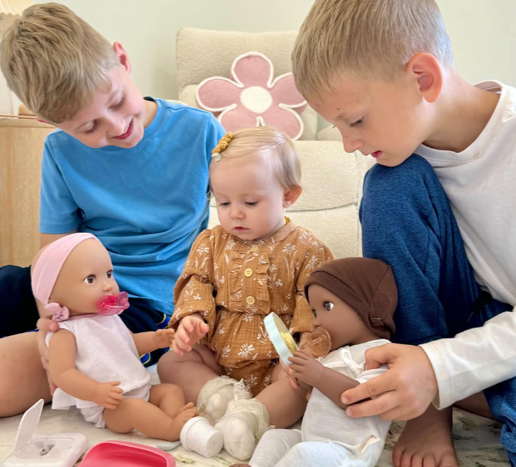 boys with younger sister, playing and feeding LullaBaby dolls