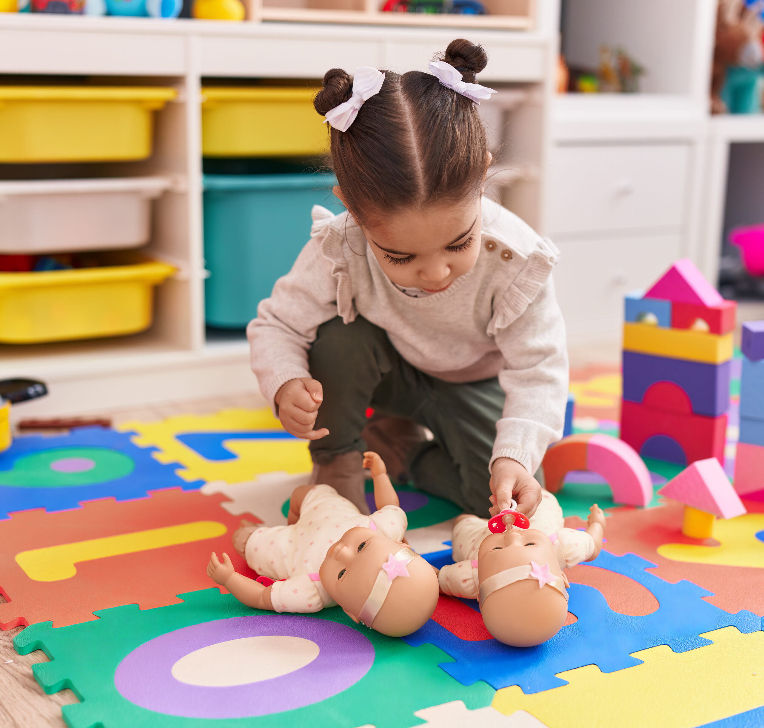 girl at daycare with baby sweetheart doll