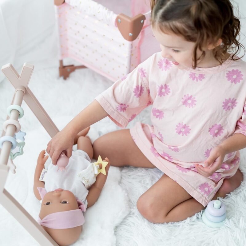 bedtime routine with dolls, girl in pjs with lullababy doll