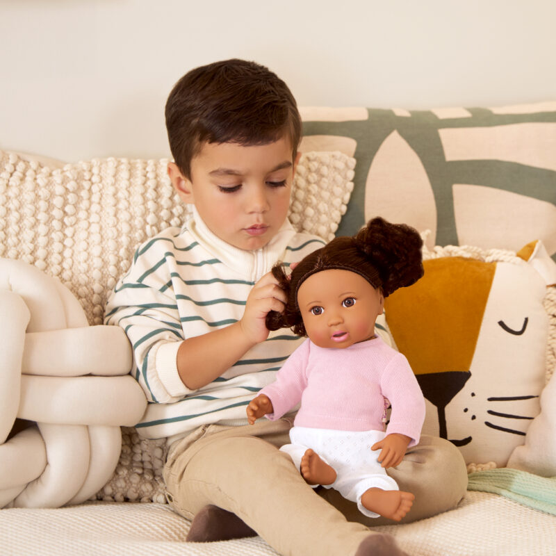 boy with lullababy doll with brown hair