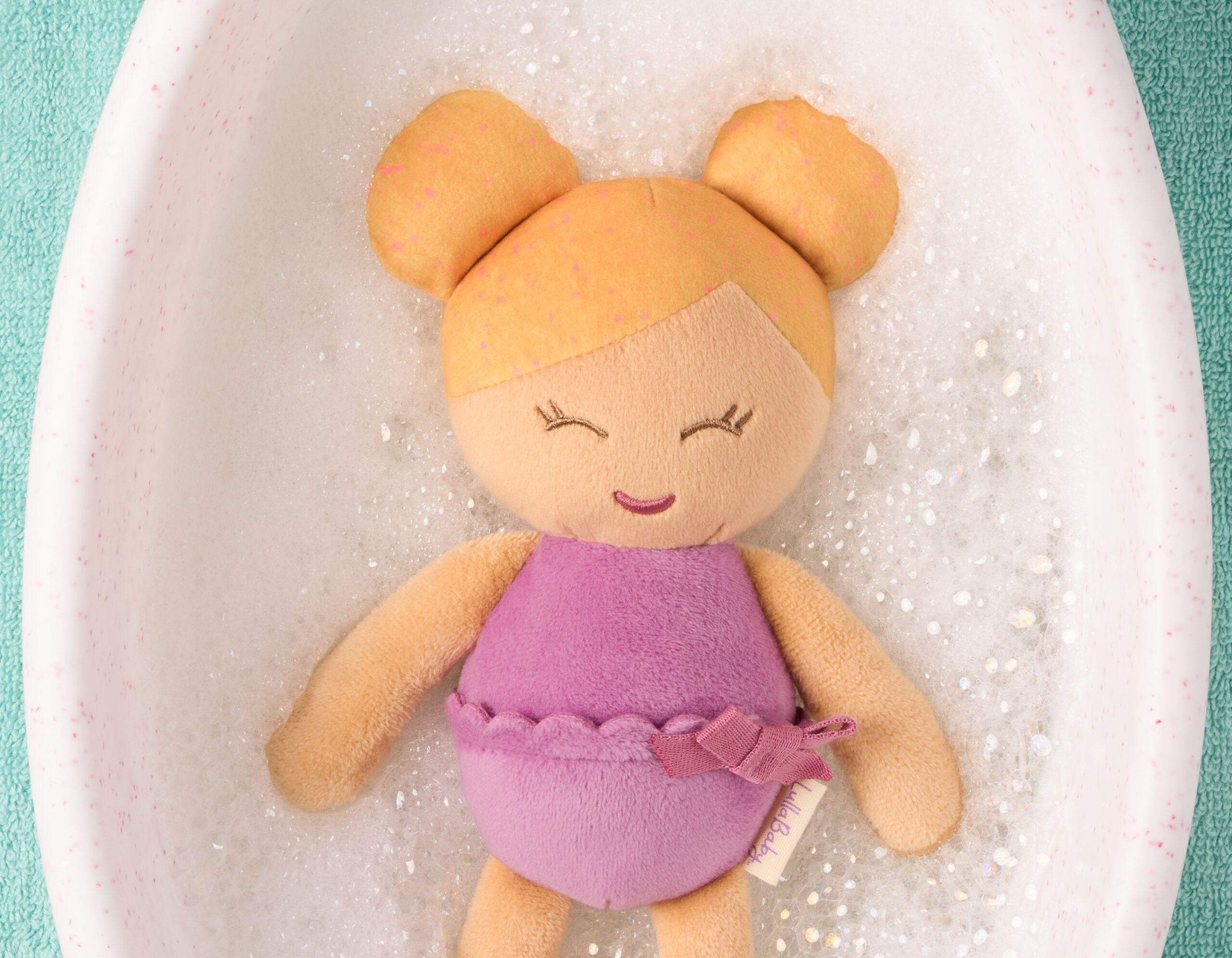 Lullababy bath doll in water, blonde