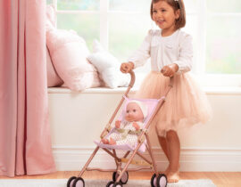 Child Pushing LullaBaby Doll Inside Stroller