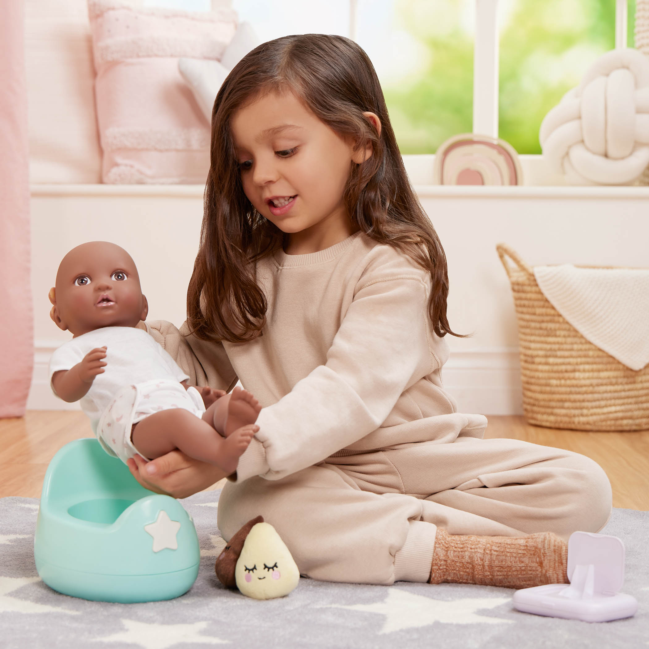 Benefits of Dolls for Children, Girl playing with LullaBaby potty set