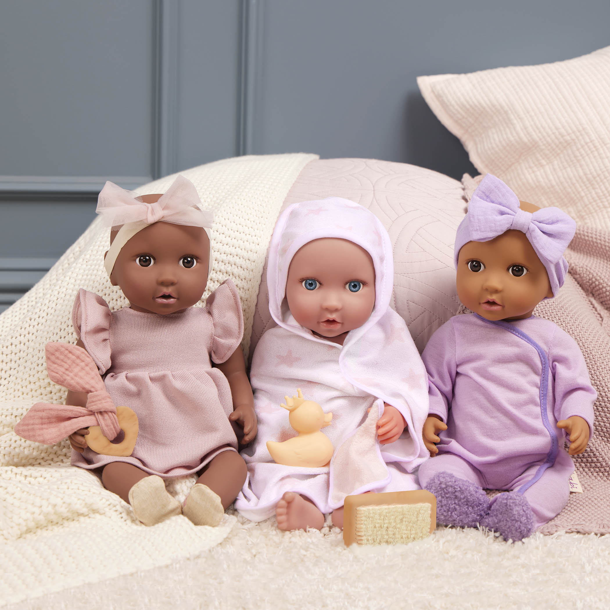 Three LullaBaby dolls in the baby doll fashion set