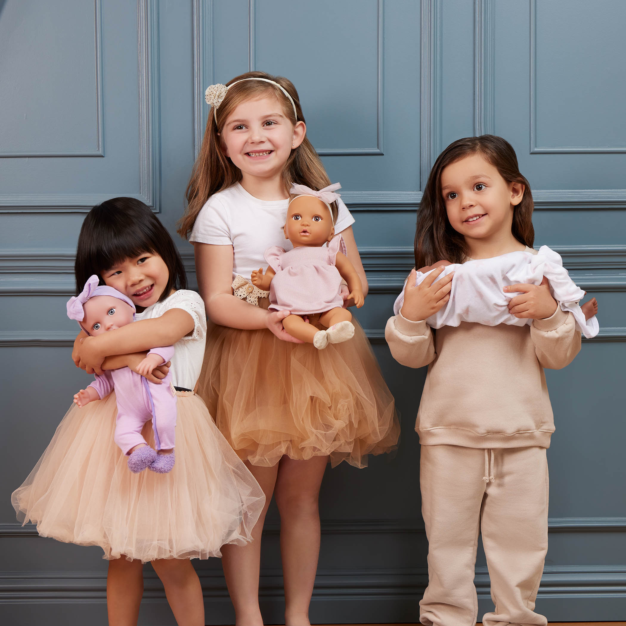 Girls and baby dolls in cute clothing