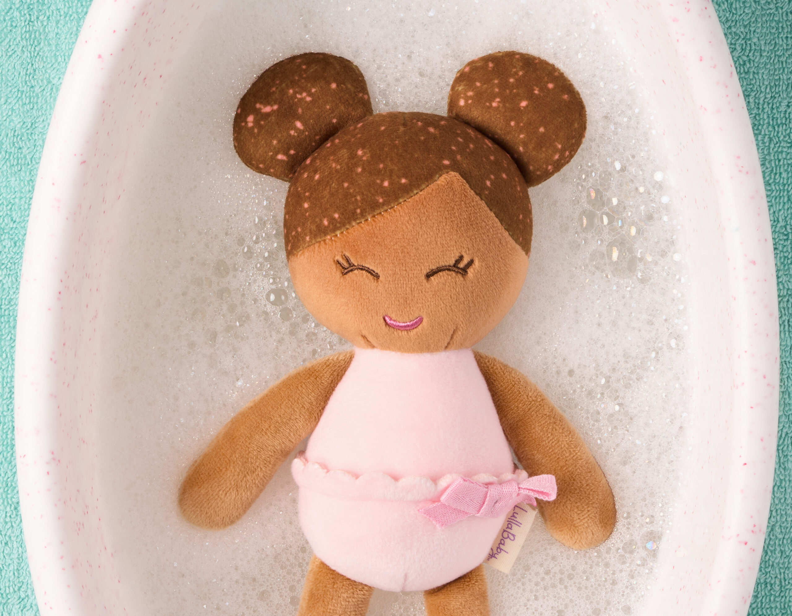 LullaBaby bath doll in water, brunette
